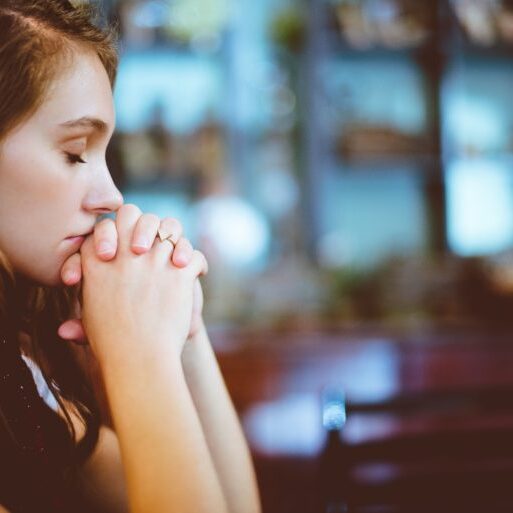 woman kneeling praying